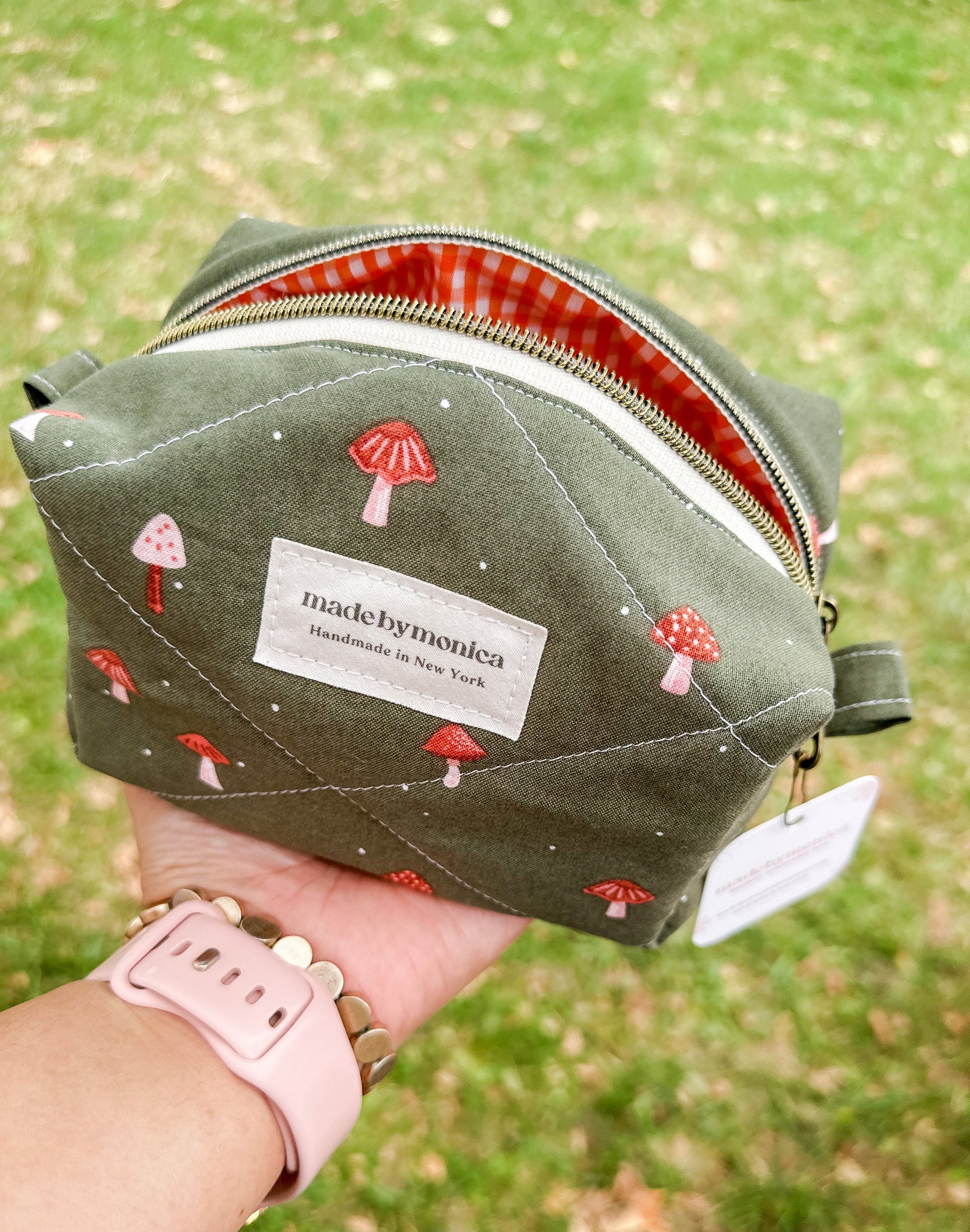 Green pouch with mushroom designs for this handmade makeup bag mini