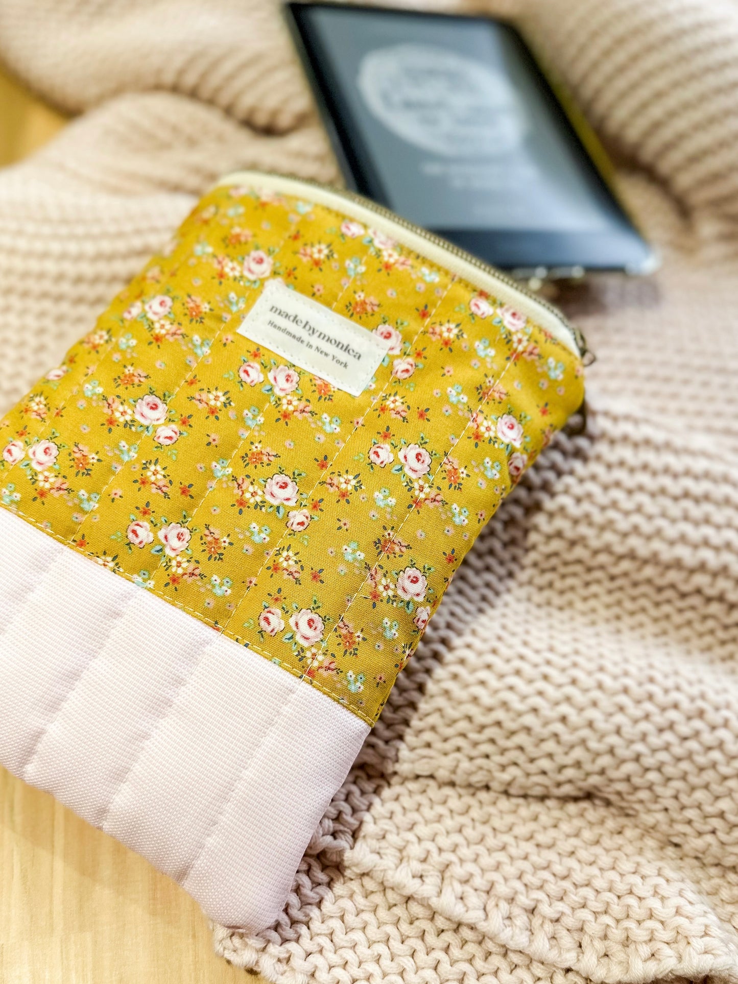 Floral-patterned pouch on a textured surface