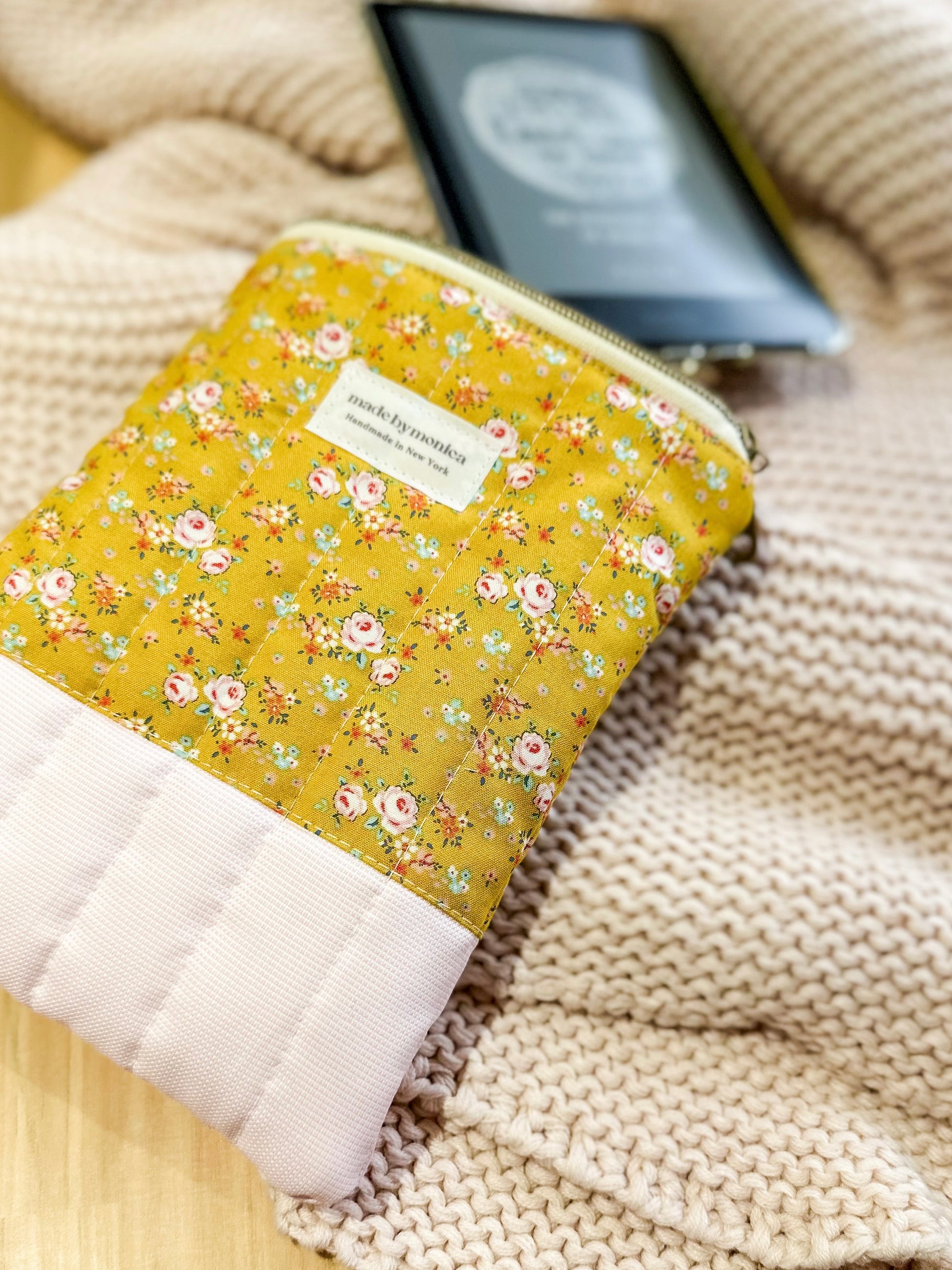 Floral-patterned pouch on a textured surface